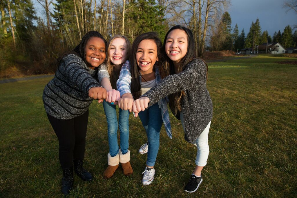 Four teenage girls of various races