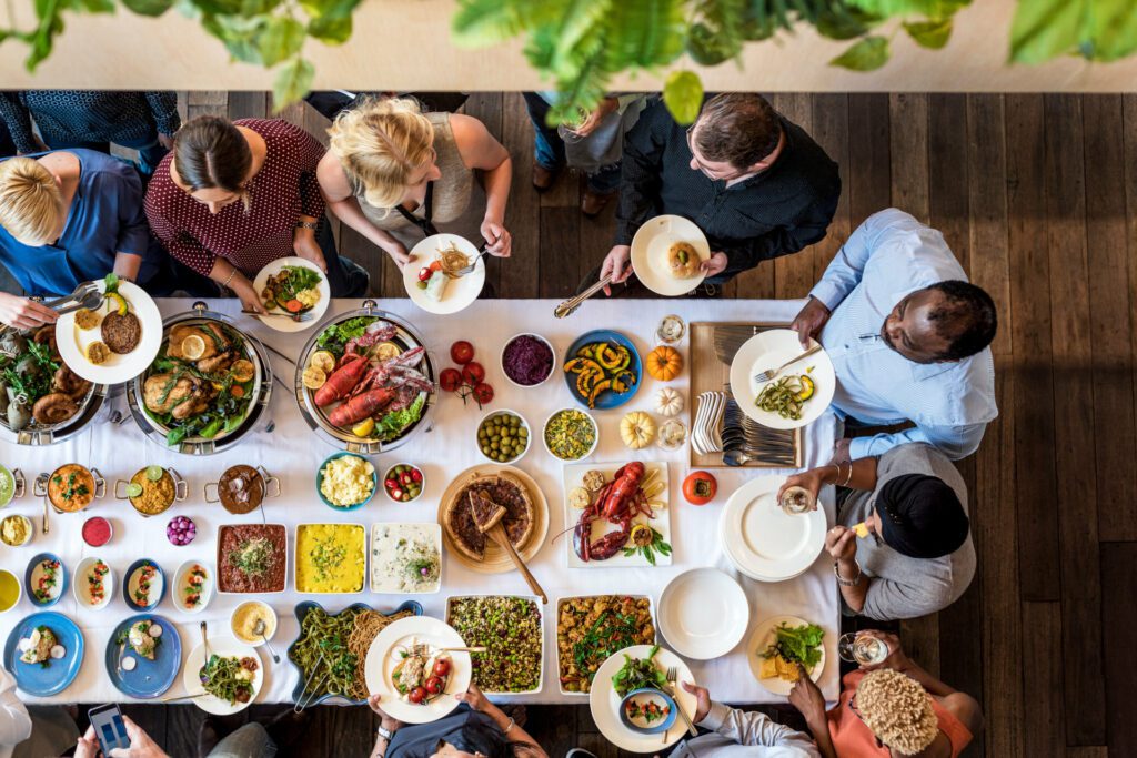 A diverse group of people sitting around a dinner table