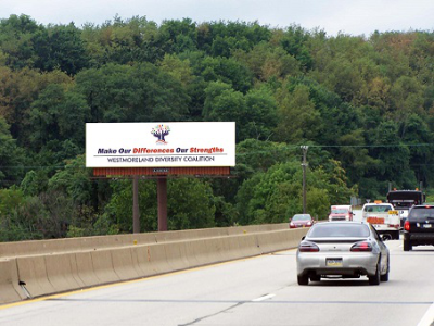 A Coalition billboard by a highway